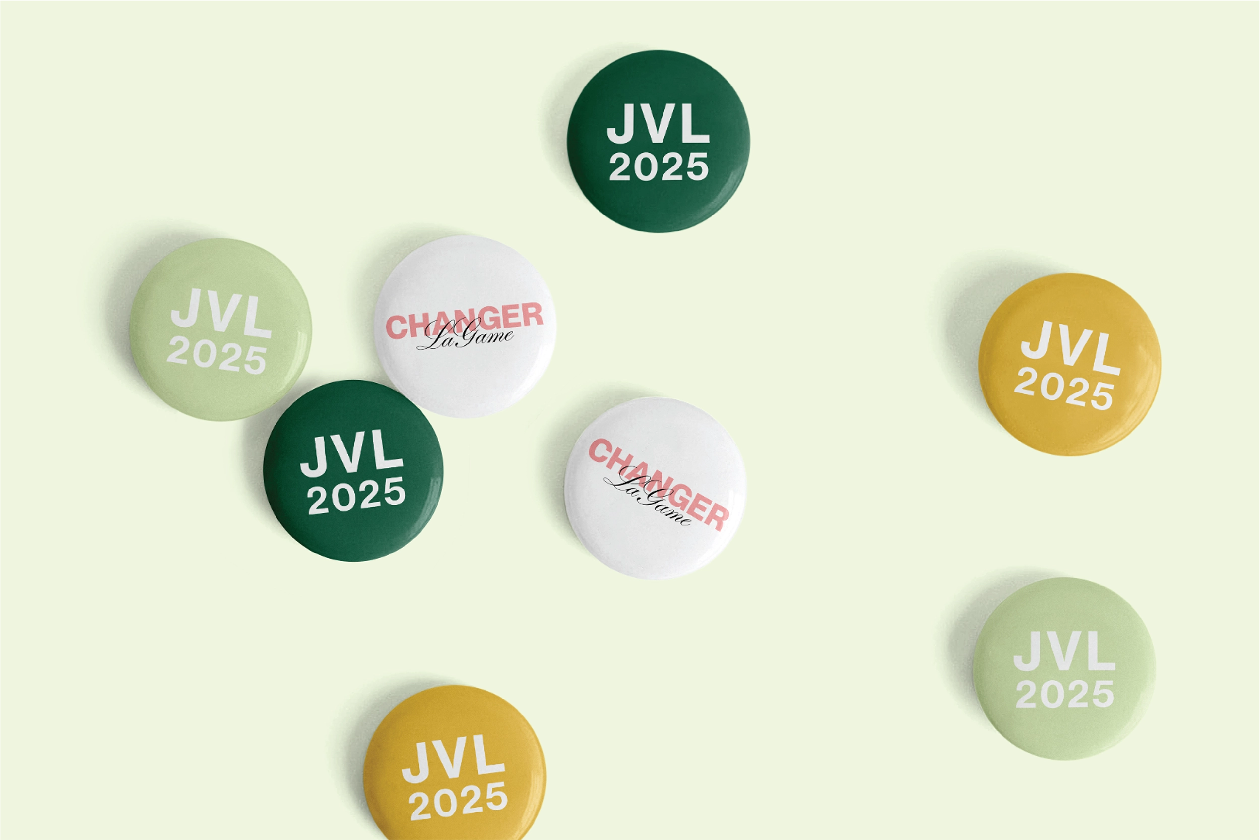 Assorted buttons with 'JVL 2025' printed on them.